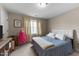 Bright bedroom with carpet flooring, neutral walls, and a double bed with a quilted comforter at 323 Windgate Dr, Clayton, NC 27527