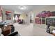 Spacious bonus room, decorated with sports memorabilia, seating and natural light at 323 Windgate Dr, Clayton, NC 27527