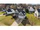 Aerial exterior showcases a well-kept lawn, a paved drive and a two-car garage at 323 Windgate Dr, Clayton, NC 27527