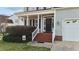 Charming front porch with a wreath and inviting welcome sign at 323 Windgate Dr, Clayton, NC 27527