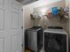 Well-lit laundry room with modern washer and dryer at 323 Windgate Dr, Clayton, NC 27527