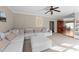 Spacious living room with cozy sectional sofa, ceiling fan, and neutral color palette at 323 Windgate Dr, Clayton, NC 27527