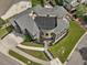 Stunning aerial view of a grand home featuring a circular driveway, mature landscaping, and a well-maintained lawn at 3315 Denada Path, Durham, NC 27707