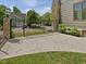 Spacious backyard featuring a stamped concrete patio, iron fencing, and lush landscaping, providing an ideal outdoor retreat at 3315 Denada Path, Durham, NC 27707