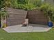 Secluded backyard featuring a modern privacy fence, a concrete patio, and well-manicured landscaping, perfect for relaxation at 3315 Denada Path, Durham, NC 27707