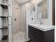 A modern bathroom featuring a glass shower and a contemporary style sink and mirror at 3315 Denada Path, Durham, NC 27707