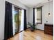 Bedroom with access to a small balcony with view of the neighborhood and a small house plant near window at 3315 Denada Path, Durham, NC 27707