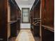 Walk-in closet with custom built-in wooden storage, offering ample space and organization at 3315 Denada Path, Durham, NC 27707