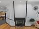 Living room fireplace with hardwood floors and minimalist decor at 3315 Denada Path, Durham, NC 27707