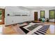 Inviting fitness room features mirrored wall, hardwood floors, and space for workout equipment at 3315 Denada Path, Durham, NC 27707