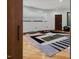 Spacious fitness room featuring ample lighting, exercise equipment, and sleek hardwood flooring at 3315 Denada Path, Durham, NC 27707