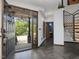 Entryway with herringbone tile floors, staircase, and partially open front door at 3315 Denada Path, Durham, NC 27707