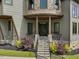 Elegant stone steps lead to the front door, framed by lush landscaping and stylish accents at 3315 Denada Path, Durham, NC 27707