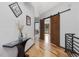 Stylish hallway features barn doors and modern decor with hardwood floors and contemporary railings at 3315 Denada Path, Durham, NC 27707