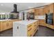 Spacious open-concept kitchen with a large center island, perfect for entertaining guests at 3315 Denada Path, Durham, NC 27707