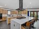 Bright kitchen with a large marble island, stainless steel appliances, and modern cabinetry at 3315 Denada Path, Durham, NC 27707