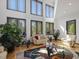 Bright living room with hardwood floors, and floor-to-ceiling windows at 3315 Denada Path, Durham, NC 27707