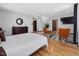 This is a view of the main bedroom featuring hardwood floors, a bed, and a comfortable seating arrangement at 3315 Denada Path, Durham, NC 27707