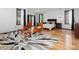 Spacious main bedroom featuring hardwood floors, modern furniture, and natural light from two windows at 3315 Denada Path, Durham, NC 27707