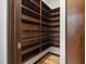 Walk-in pantry showcasing custom built-in wooden shelving, providing ample storage space at 3315 Denada Path, Durham, NC 27707