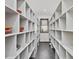 Walk-in pantry with custom shelving provides ample storage space for food and supplies at 3315 Denada Path, Durham, NC 27707