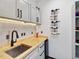 Small pantry wet bar featuring light cabinets, butcher block countertop, and a wine rack at 3315 Denada Path, Durham, NC 27707