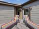 Relax on the patio with these striped lounge chairs for sunbathing at 3315 Denada Path, Durham, NC 27707