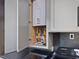 Water heater with an open cabinet in the laundry area at 3315 Denada Path, Durham, NC 27707
