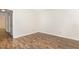 Bedroom with wood-look flooring and neutral walls at 3325 Tarleton E, Durham, NC 27713