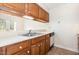 Kitchen features oak cabinets, white countertops, and stainless steel appliances at 3325 Tarleton E, Durham, NC 27713