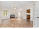 Inviting living room features a fireplace, ceiling fan and door leading to deck at 3325 Tarleton E, Durham, NC 27713