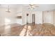 Open concept living and dining area featuring a ceiling fan and breakfast bar at 3325 Tarleton E, Durham, NC 27713