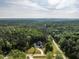 Aerial view of the beautiful new construction home nestled in a dense forest canopy at 40 Ridgeline Ct # 10, Pittsboro, NC 27312