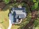 Stunning aerial view of a modern home with lush landscaping and a winding driveway on a sunny day at 40 Ridgeline Ct # 10, Pittsboro, NC 27312