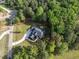 Beautiful aerial view of the new construction home nestled in a canopy of green trees at 40 Ridgeline Ct # 10, Pittsboro, NC 27312