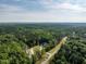 Breathtaking aerial view of new home nestled in a lush green canopy of trees at 40 Ridgeline Ct # 10, Pittsboro, NC 27312