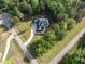 Aerial view of a stunning new construction home with a manicured lawn and tree coverage at 40 Ridgeline Ct # 10, Pittsboro, NC 27312