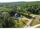Scenic aerial view of a modern home on a large lot with lush greenery and a driveway at 40 Ridgeline Ct # 10, Pittsboro, NC 27312
