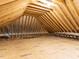 Unfinished attic space shows open rafters and plywood subfloor at 40 Ridgeline Ct # 10, Pittsboro, NC 27312