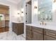 Bathroom featuring dual vanities, decorative mirrors, and walk-in shower at 40 Ridgeline Ct # 10, Pittsboro, NC 27312