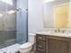 Modern bathroom with a glass-enclosed shower, gray subway tile, granite countertop vanity, and gold fixtures at 40 Ridgeline Ct # 10, Pittsboro, NC 27312
