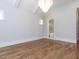 Unfurnished bedroom with hardwood floors, large windows, and ensuite bathroom at 40 Ridgeline Ct # 10, Pittsboro, NC 27312