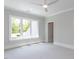 Bright and open bedroom features plush carpeting, a ceiling fan, and natural light from large windows at 40 Ridgeline Ct # 10, Pittsboro, NC 27312
