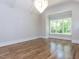 Spacious bedroom featuring hardwood floors, large window and modern chandelier at 40 Ridgeline Ct # 10, Pittsboro, NC 27312