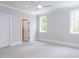 Bright bedroom features soft carpeting, a ceiling fan, and large windows providing natural light at 40 Ridgeline Ct # 10, Pittsboro, NC 27312