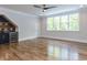 Spacious bonus room boasts hardwood floors, a ceiling fan, and a convenient wet bar with a wine fridge at 40 Ridgeline Ct # 10, Pittsboro, NC 27312