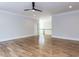 An open bonus room with hardwood floors and a ceiling fan offers flexible space for living and entertaining at 40 Ridgeline Ct # 10, Pittsboro, NC 27312