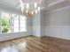 Elegant dining room with hardwood floors and a stylish chandelier at 40 Ridgeline Ct # 10, Pittsboro, NC 27312