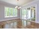 Sun-filled dining area with large windows and access to the outdoor patio at 40 Ridgeline Ct # 10, Pittsboro, NC 27312