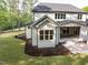 A lovely backyard featuring a well-maintained lawn, a covered patio, and tasteful landscaping at 40 Ridgeline Ct # 10, Pittsboro, NC 27312